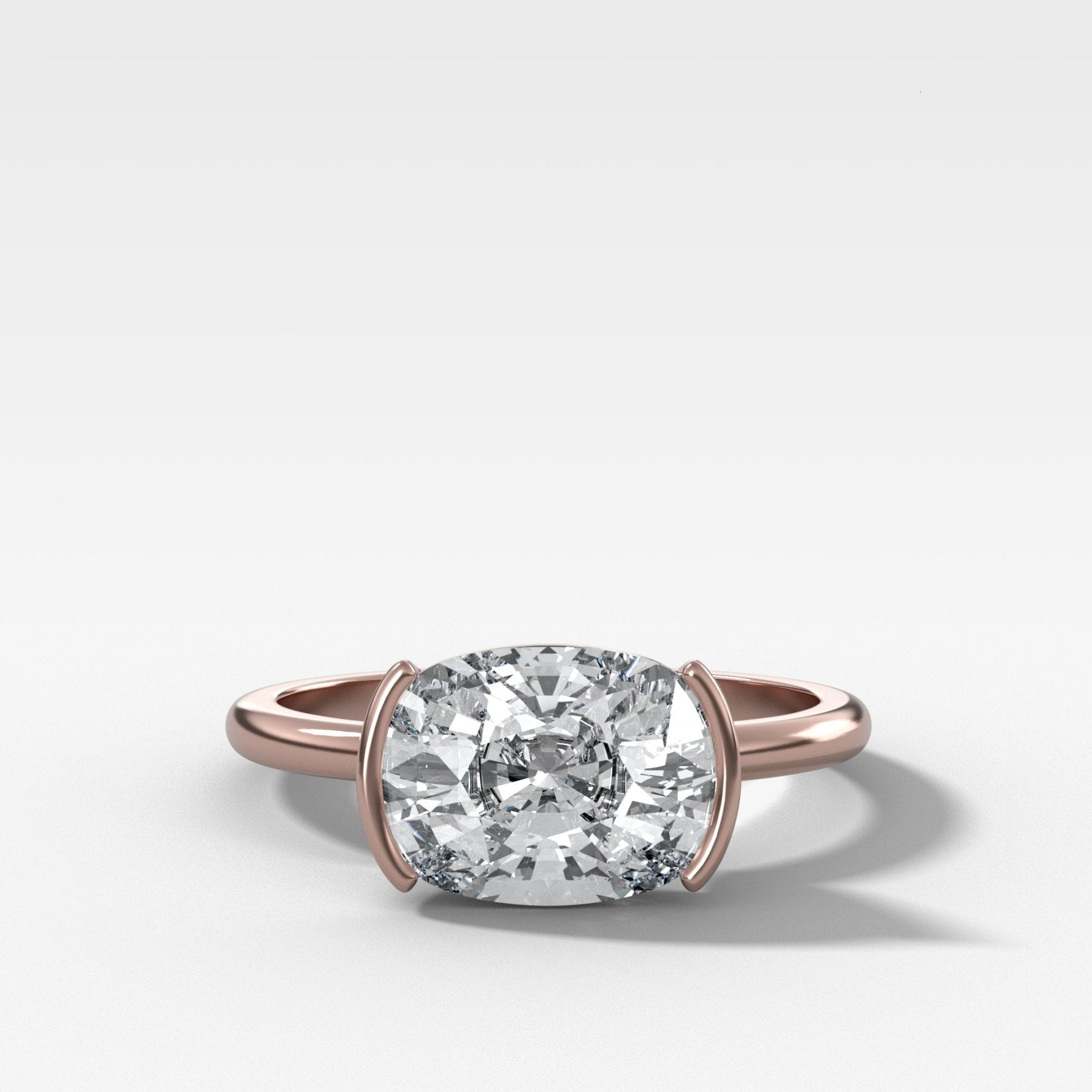 East West Half Bezel Solitaire Engagement Ring With Elongated Cushion Cut Diamond