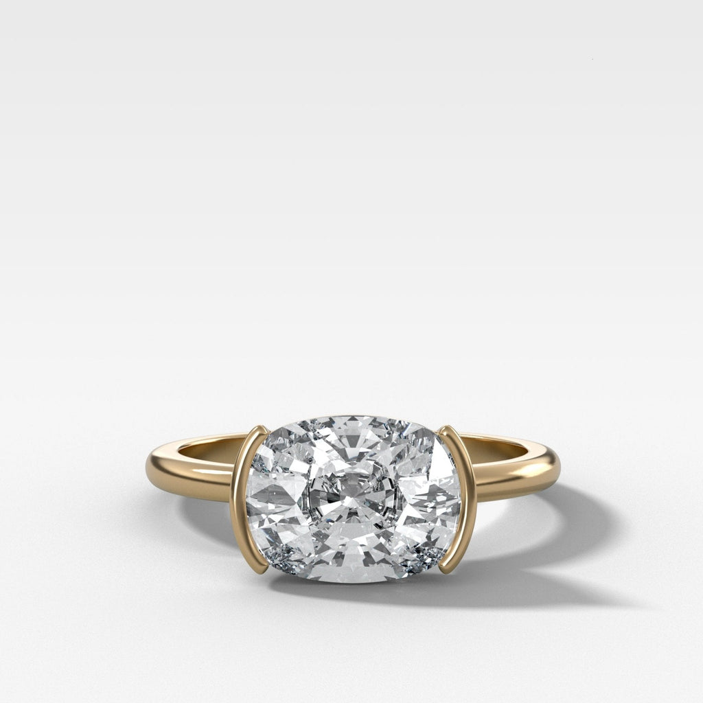 East West Half Bezel Solitaire Engagement Ring With Elongated Cushion Cut Diamond
