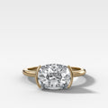 East West Half Bezel Solitaire Engagement Ring With Elongated Cushion Cut Diamond