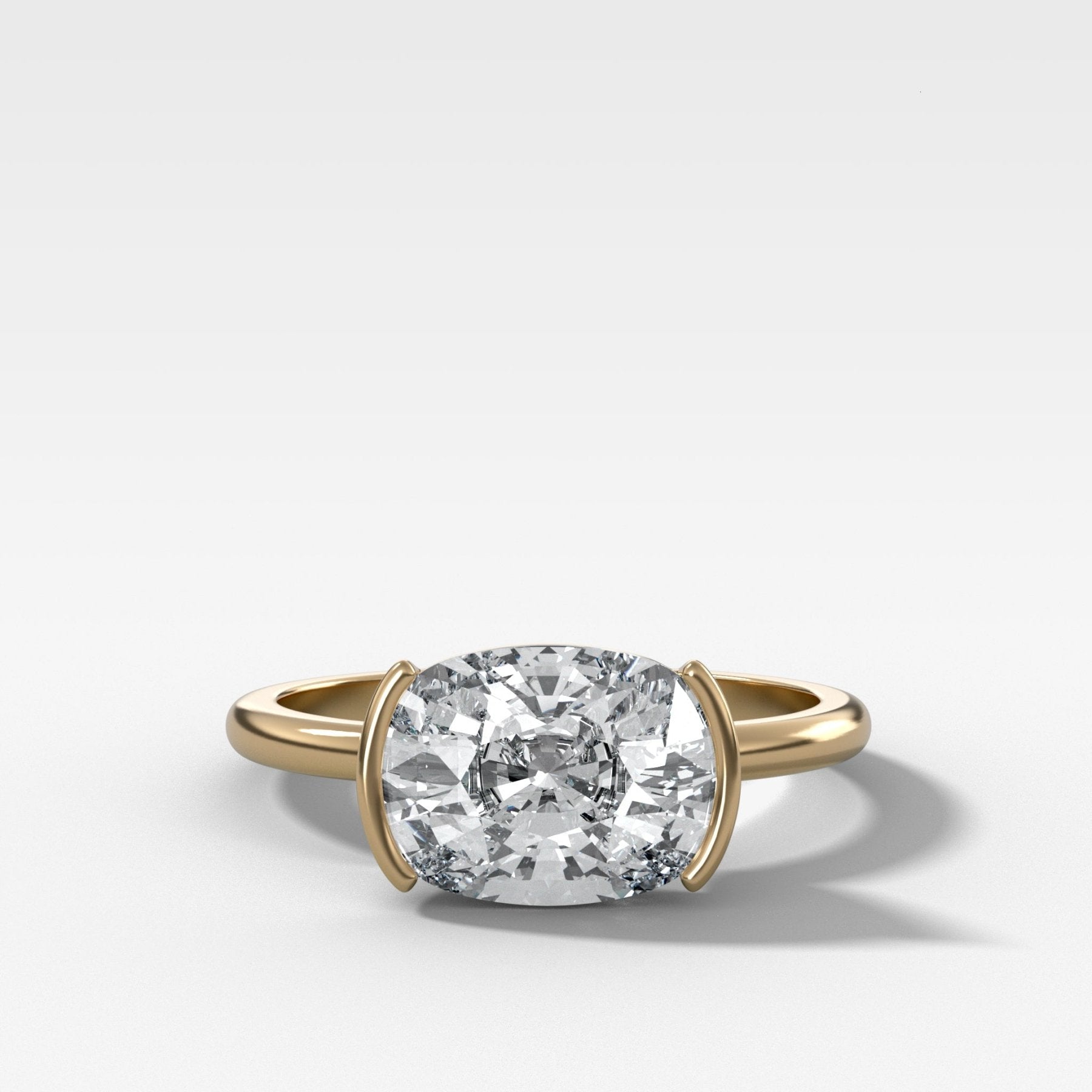 East West Half Bezel Solitaire Engagement Ring With Elongated Cushion Cut Diamond
