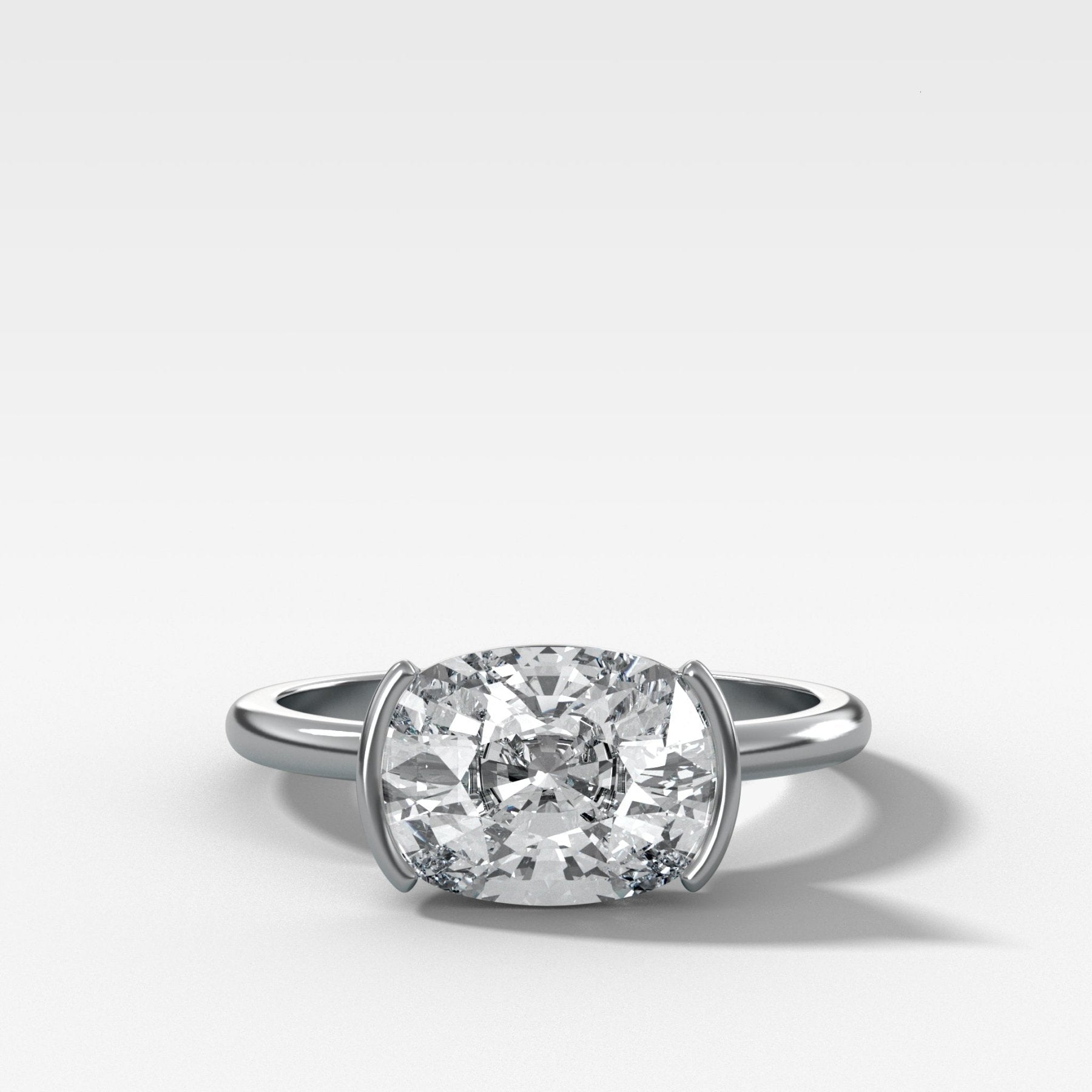 East West Half Bezel Solitaire Engagement Ring With Elongated Cushion Cut Diamond