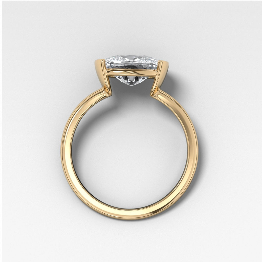 East West Half Bezel Solitaire Engagement Ring With Elongated Cushion Cut Diamond