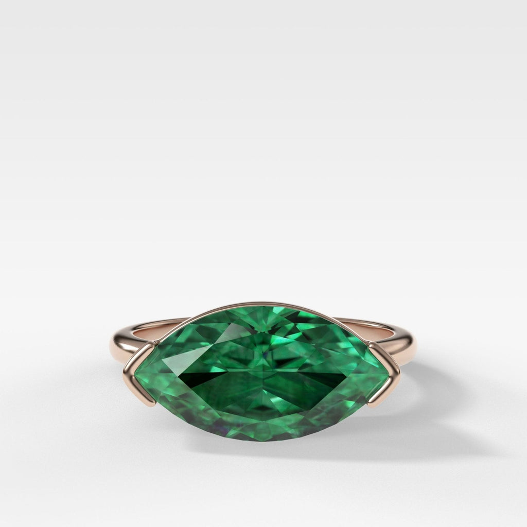 East West Half Bezel Solitaire Engagement Ring With Marquise Cut Green Emerald