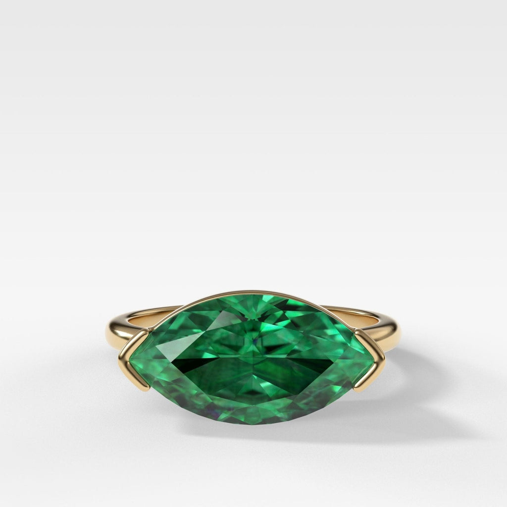 East West Half Bezel Solitaire Engagement Ring With Marquise Cut Green Emerald