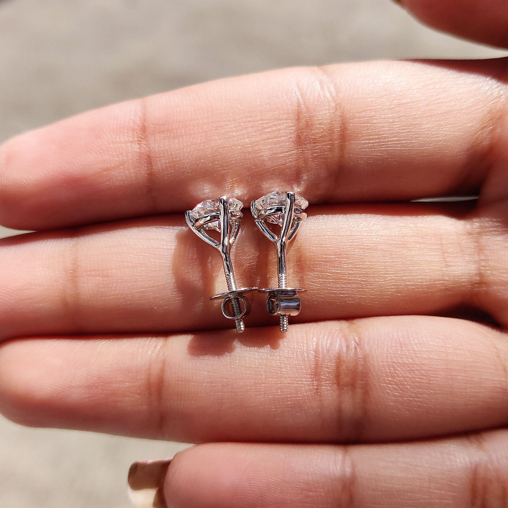 Round Cut Moissanite Earrings In Stud Style