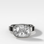 Finest Bezel Set Engagement Ring With East West Elongated Cushion Cut Diamond