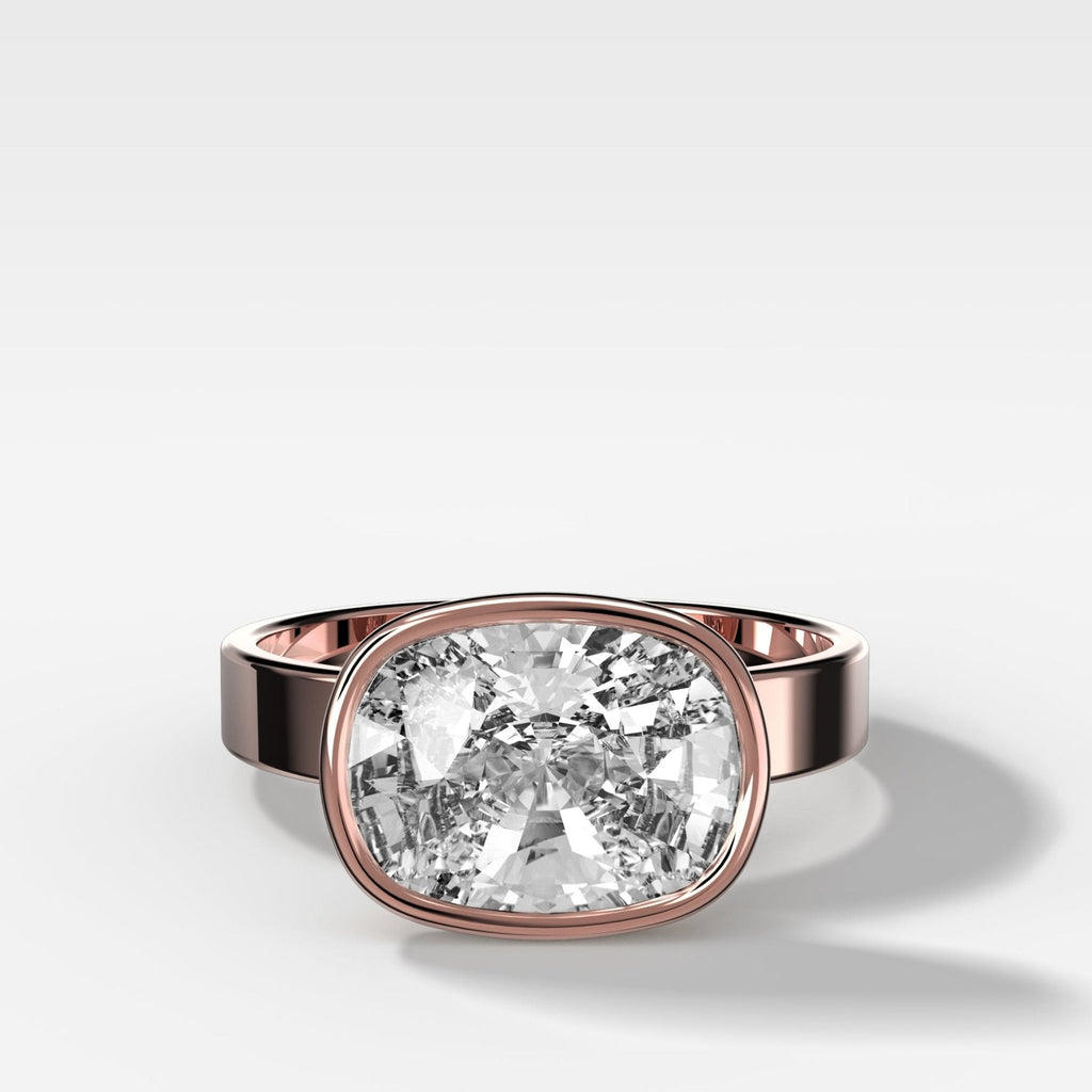 Finest Bezel Set Engagement Ring With East West Elongated Cushion Cut Diamond