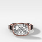 Finest Bezel Set Engagement Ring With East West Elongated Cushion Cut Diamond