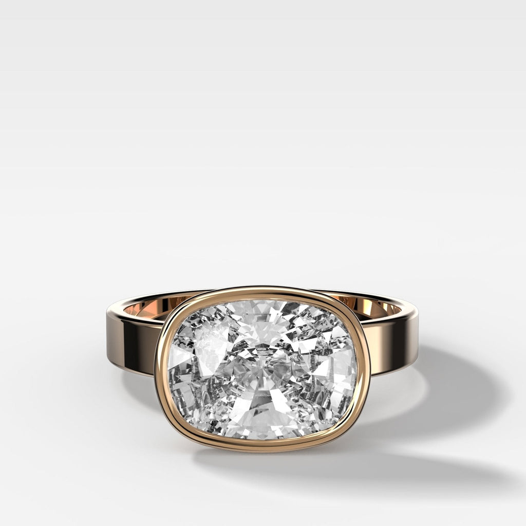 Finest Bezel Set Engagement Ring With East West Elongated Cushion Cut Diamond