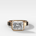 Finest Bezel Set Engagement Ring With East West Elongated Radiant Cut Diamond