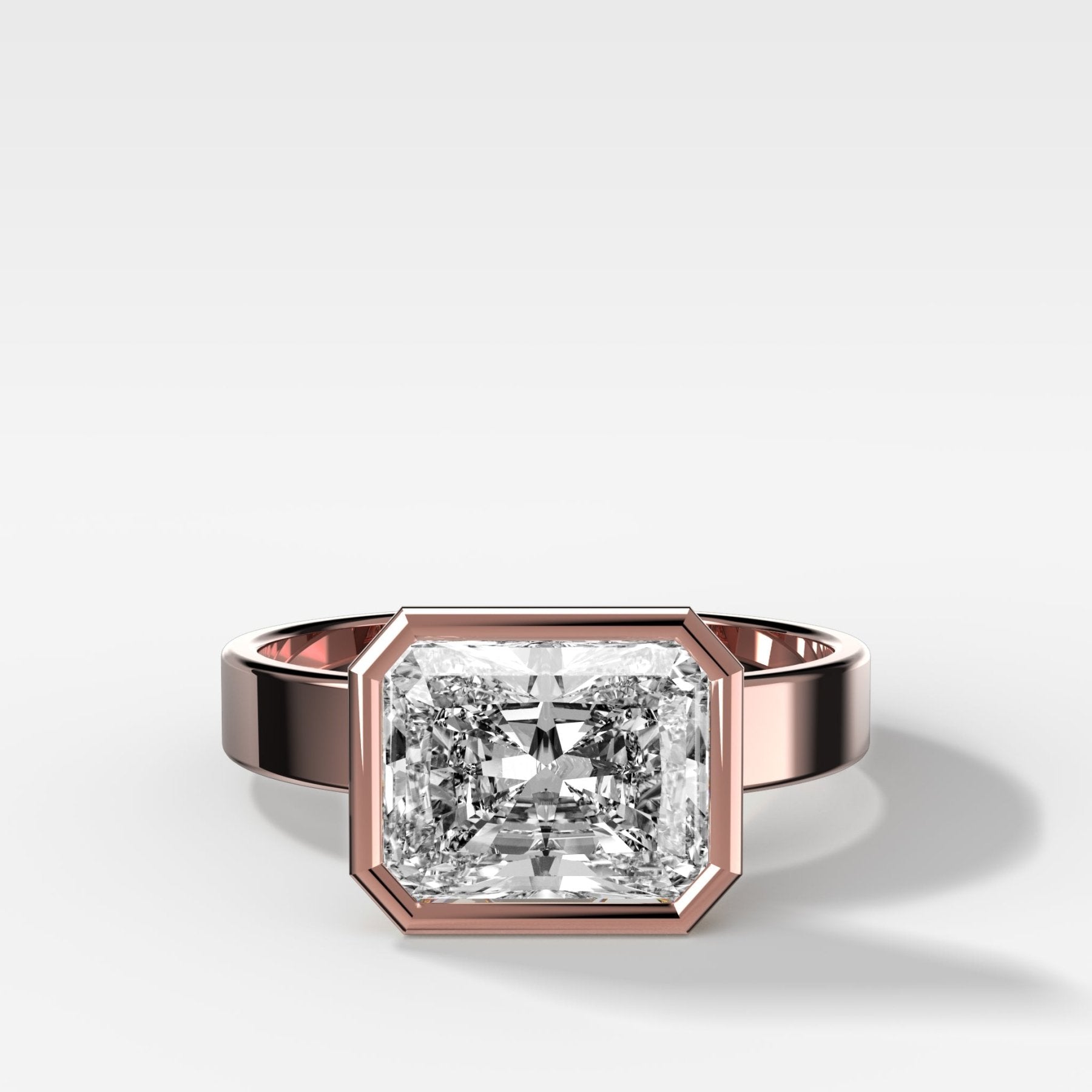Finest Bezel Set Engagement Ring With East West Elongated Radiant Cut Diamond