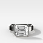 Finest Bezel Set Engagement Ring With East West Emerald Cut Diamond