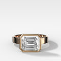 Finest Bezel Set Engagement Ring With East West Emerald Cut Diamond