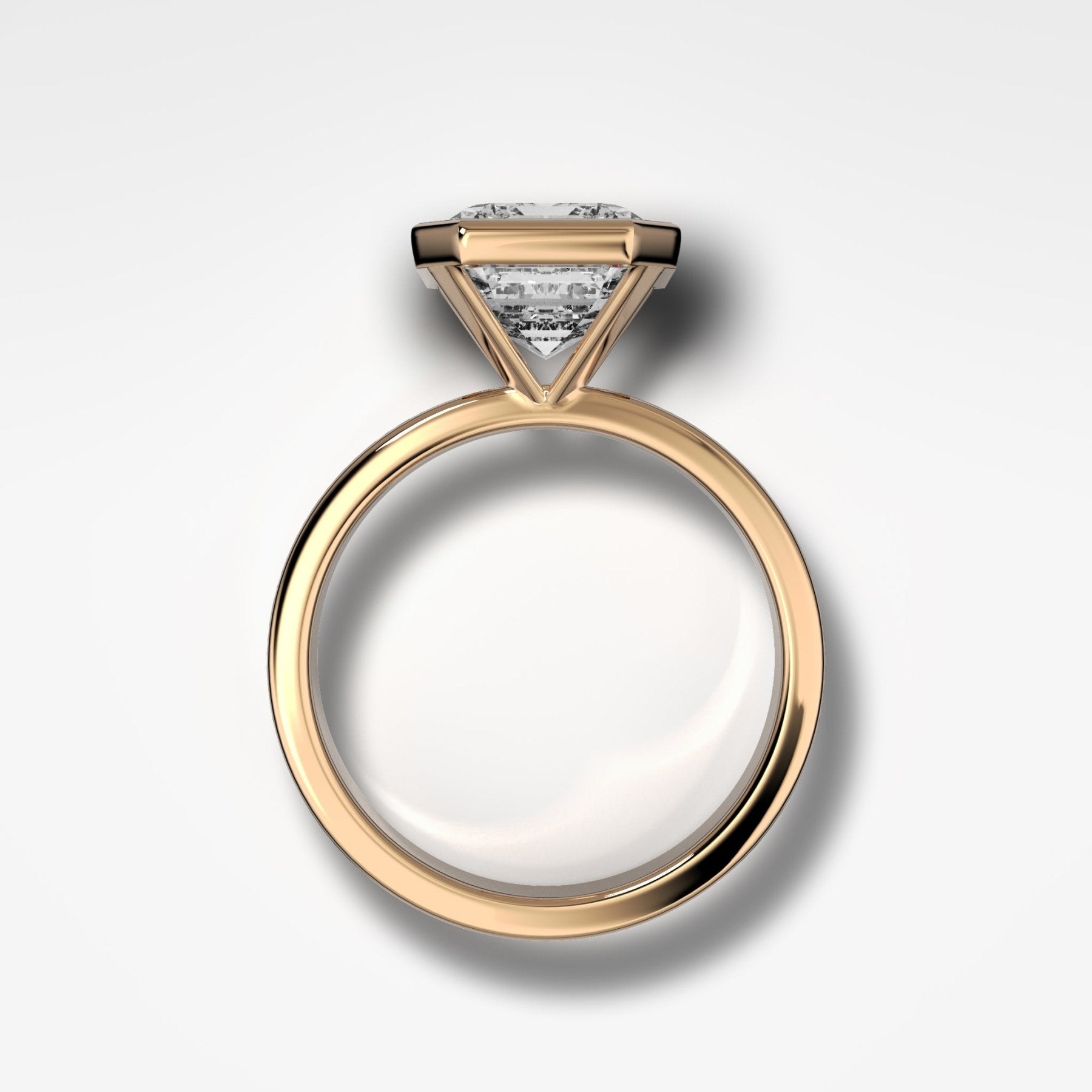 Finest Bezel Set Engagement Ring With Emerald Cut Diamond