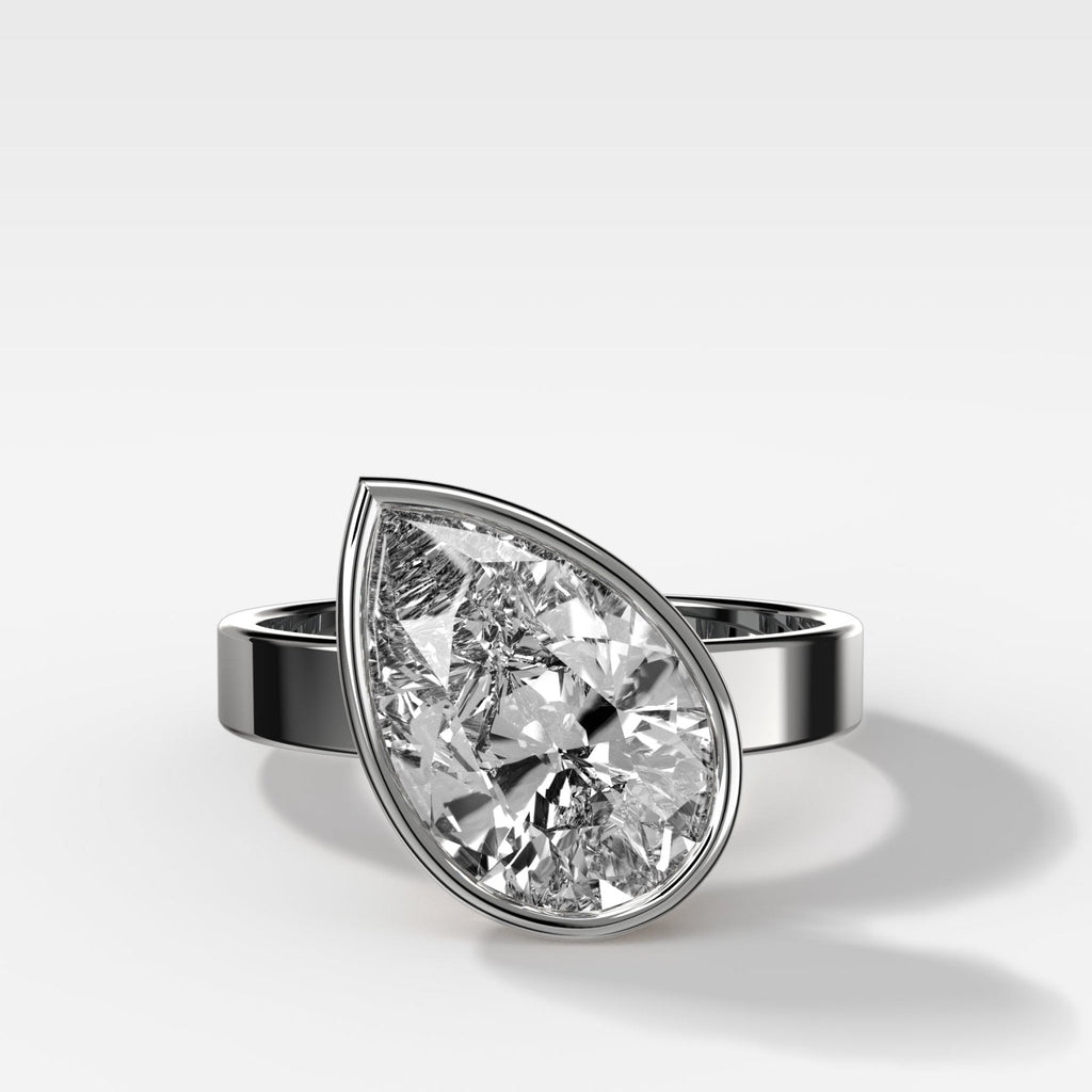 Finest Bezel Set Engagement Ring With Tilted Pear