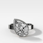 Finest Bezel Set Engagement Ring With Tilted Pear