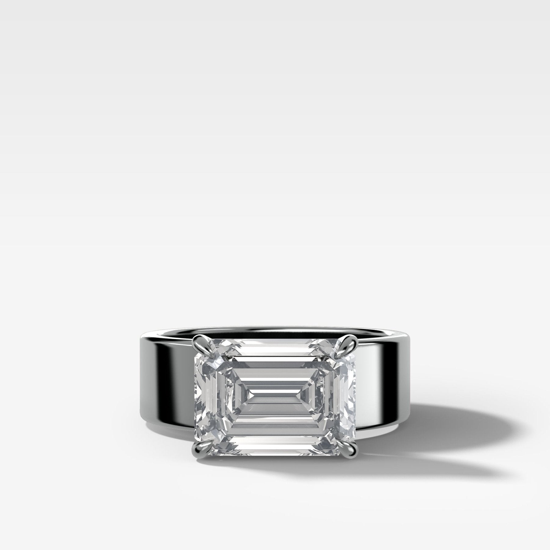Finest Cigar Band Engagement Ring with East West Emerald Cut Diamond