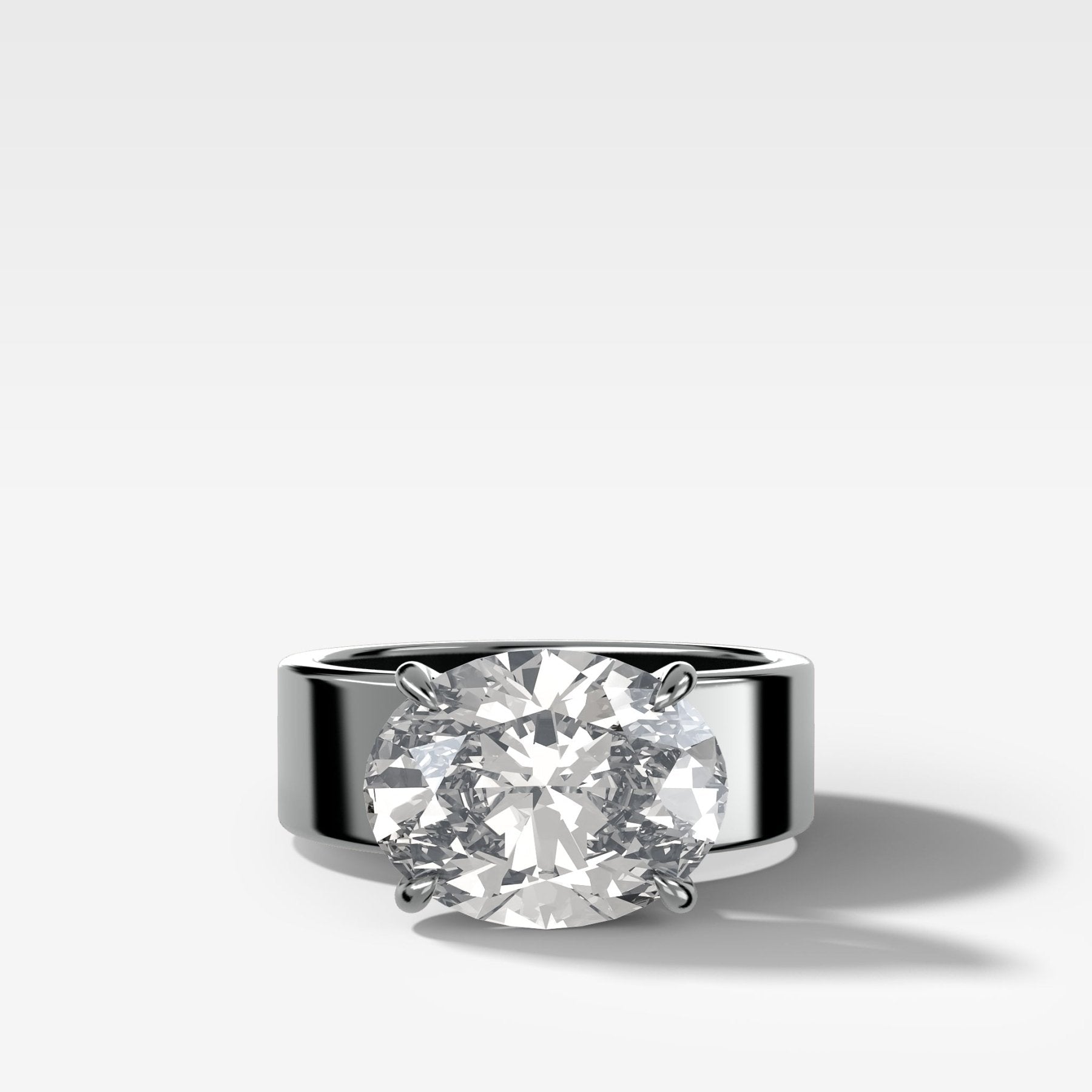 Finest Cigar Band Engagement Ring with East West Oval Cut Diamond