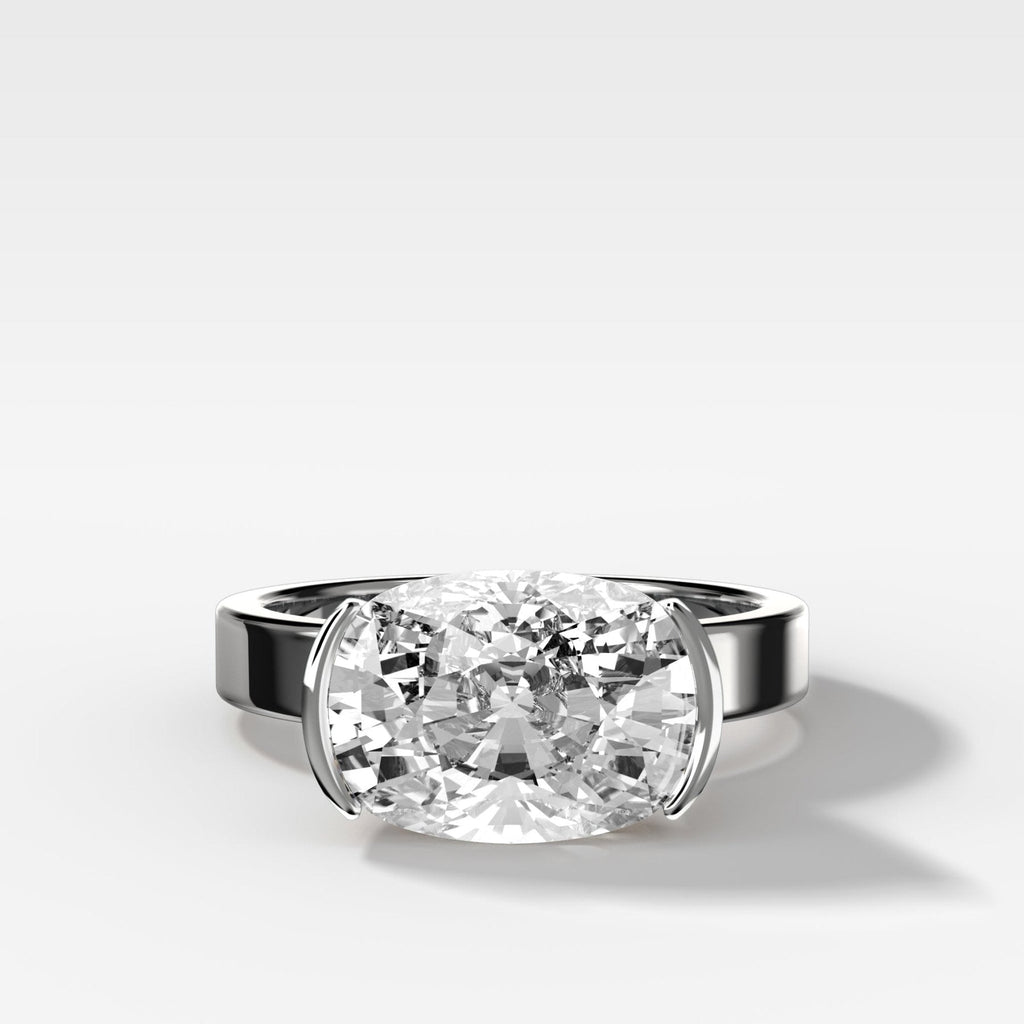 Finest Half Bezel Solitaire Engagement Ring With East West Elongated Cushion Cut Diamond