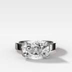 Finest Half Bezel Solitaire Engagement Ring With East West Elongated Cushion Cut Diamond