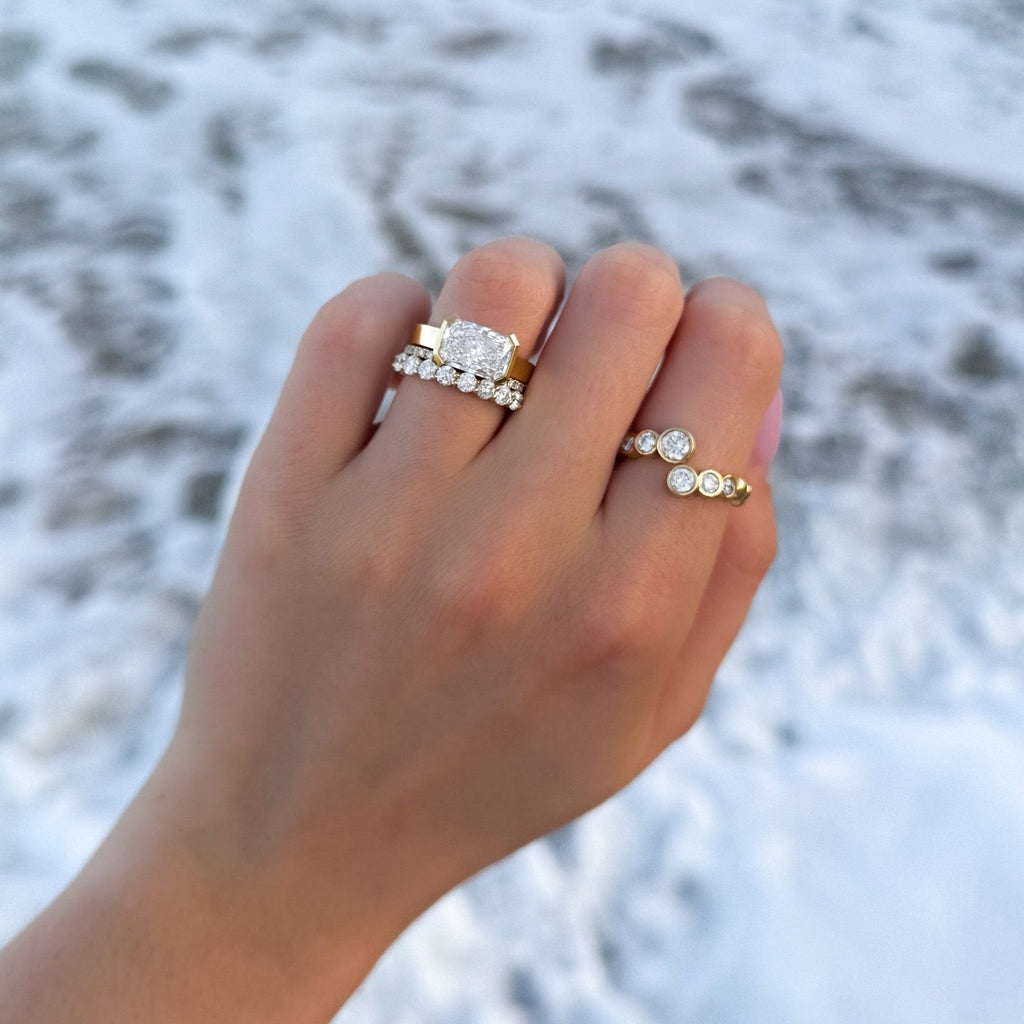 Finest Half Bezel Solitaire Engagement Ring With East West Elongated Radiant Cut Diamond