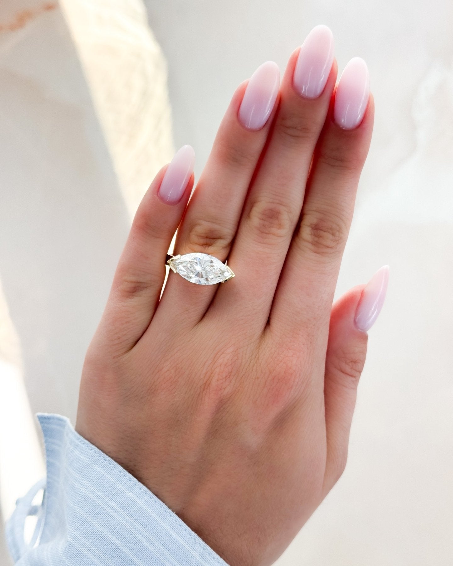 Finest Half Bezel Solitaire Engagement Ring With East West Marquise Cut Diamond