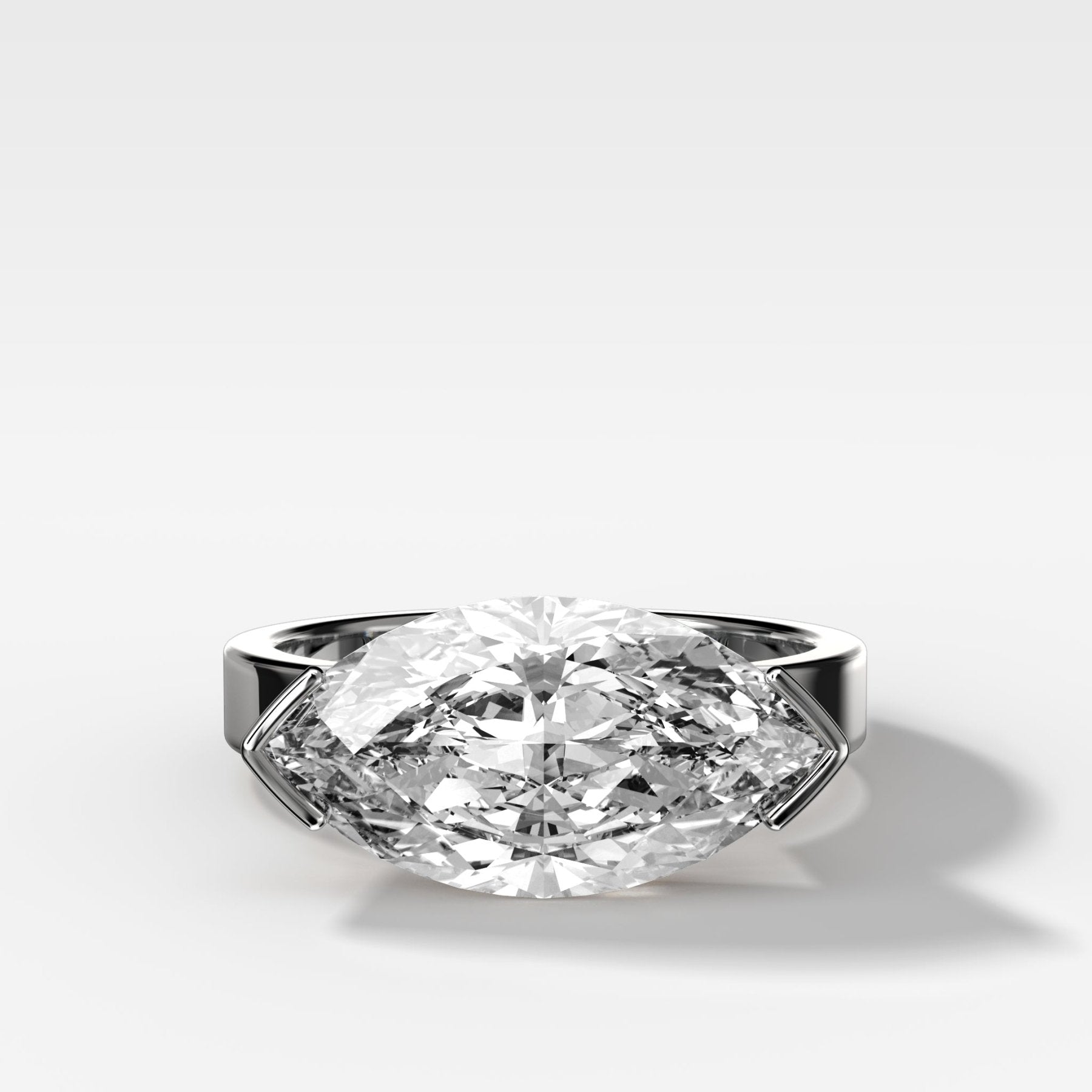 Finest Half Bezel Solitaire Engagement Ring With East West Marquise Cut Diamond