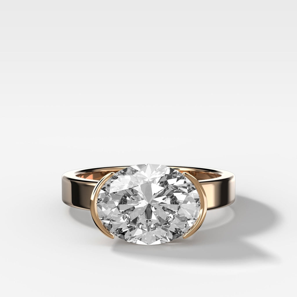 Finest Half Bezel Solitaire Engagement Ring With East West Oval Cut Diamond