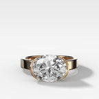 Finest Half Bezel Solitaire Engagement Ring With East West Oval Cut Diamond