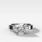 Finest Half Bezel Solitaire Engagement Ring With East West Oval Cut Diamond