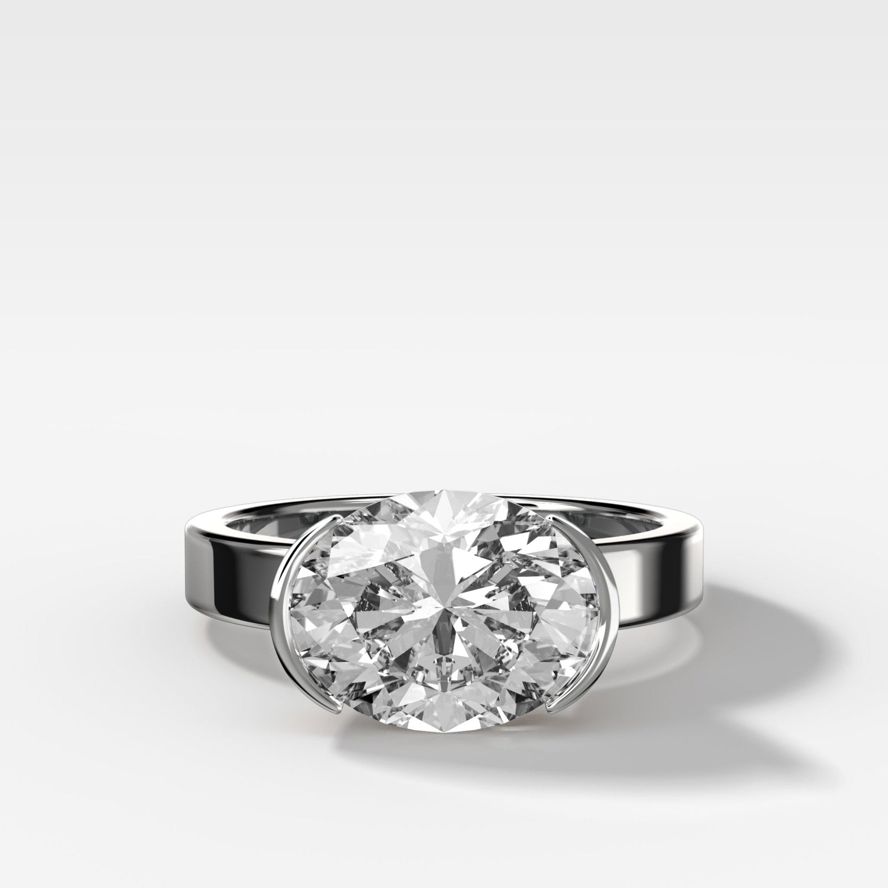 Finest Half Bezel Solitaire Engagement Ring With East West Oval Cut Diamond