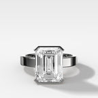 Finest Half Bezel Solitaire Engagement Ring With Emerald Cut Diamond