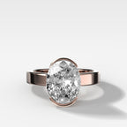 Finest Half Bezel Solitaire Engagement Ring With Oval Cut Diamond