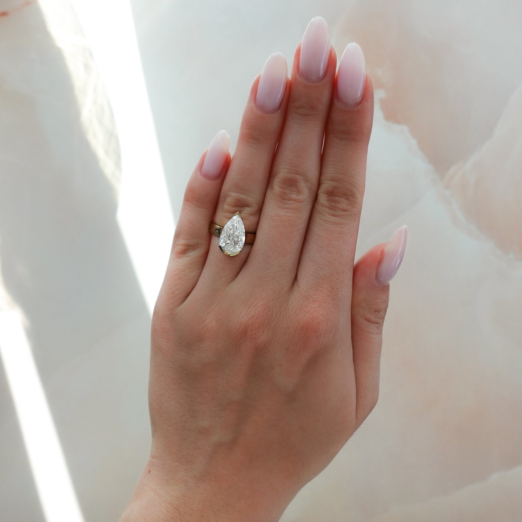 Finest Half Bezel Solitaire Engagement Ring With Pear Cut Diamond