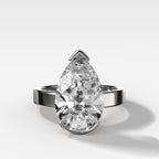 Finest Half Bezel Solitaire Engagement Ring With Pear Cut Diamond