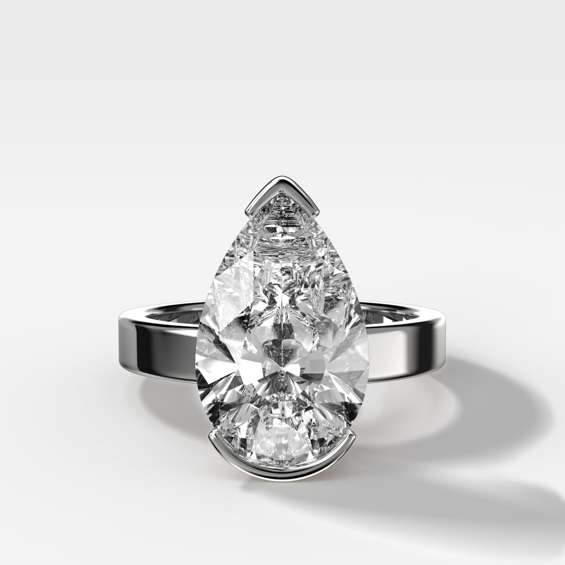 Finest Half Bezel Solitaire Engagement Ring With Pear Cut Diamond