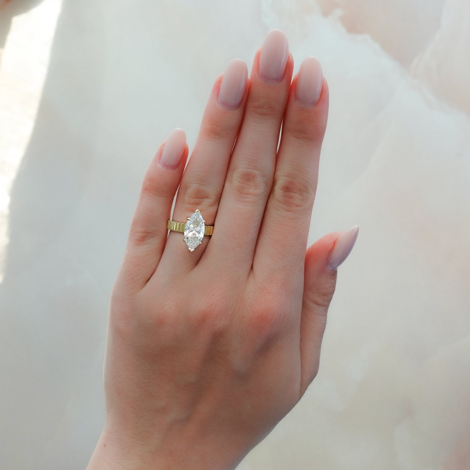 Finest Ridged Solitaire Engagement Ring With Marquise Cut Diamond