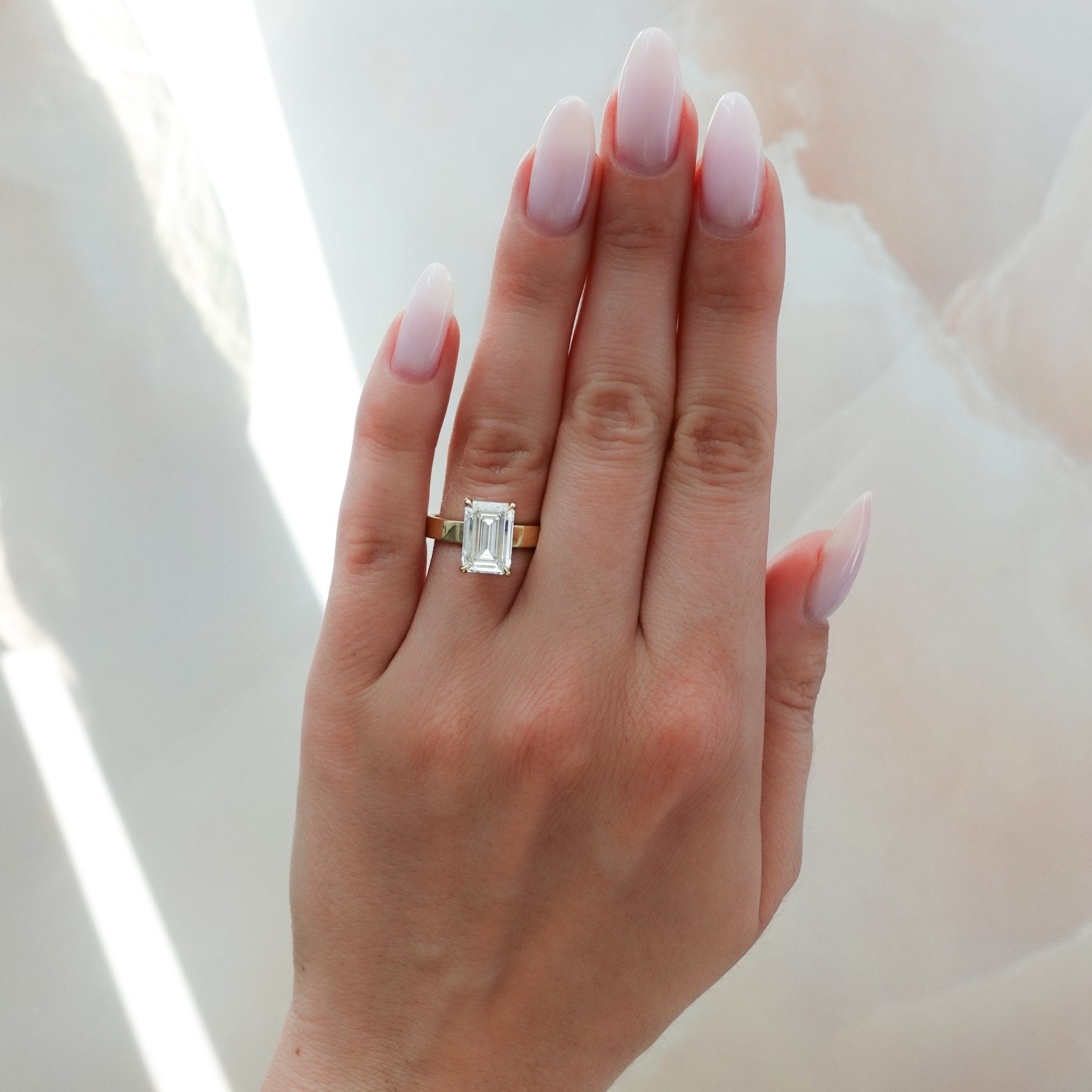 Finest Solitaire Engagement Ring With Emerald Cut Diamond