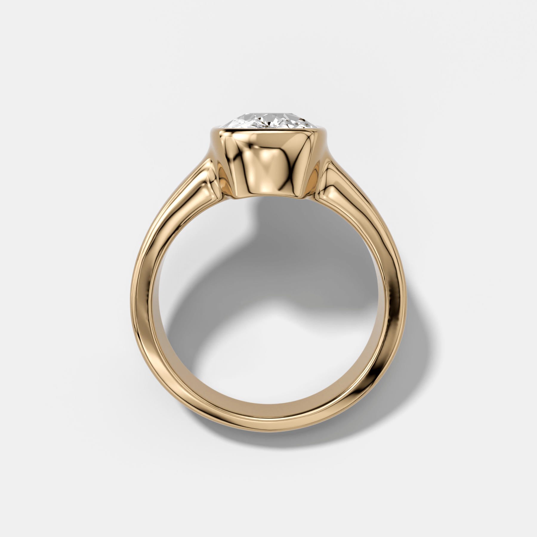 Finest Tapered Bezel Set Engagement Ring With Elongated Cushion Cut Diamond