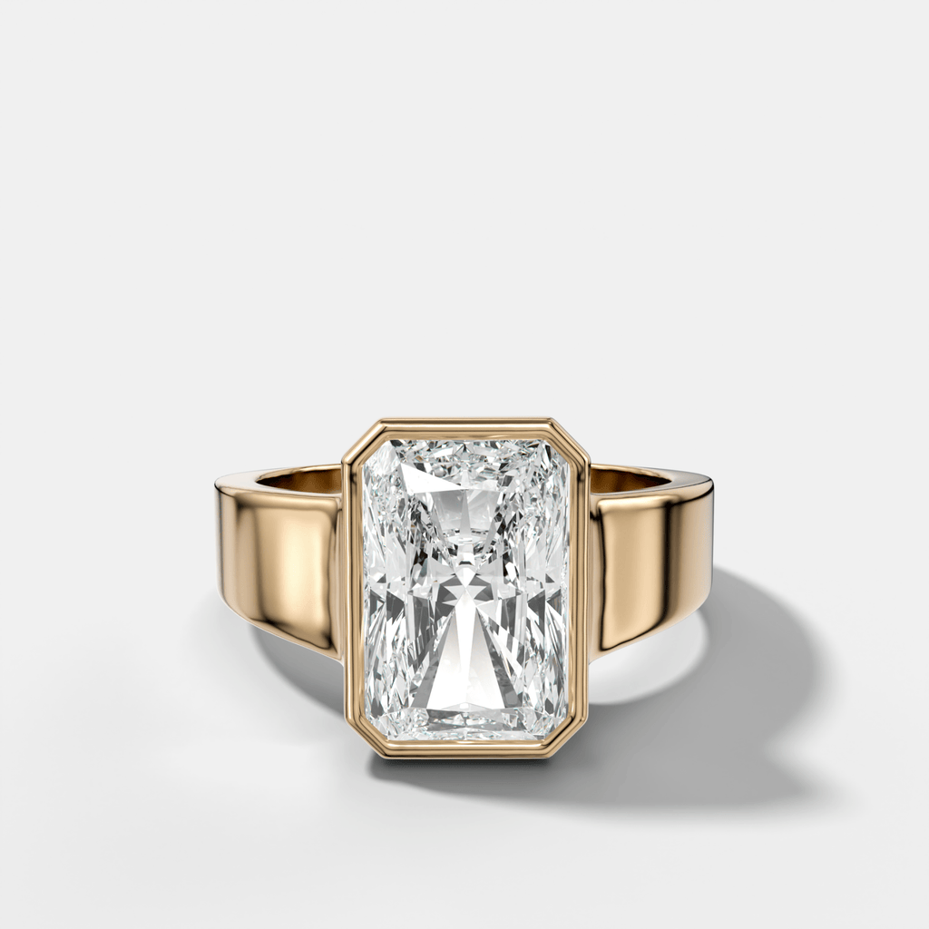 Finest Tapered Bezel Set Engagement Ring With Elongated Radiant Cut Diamond
