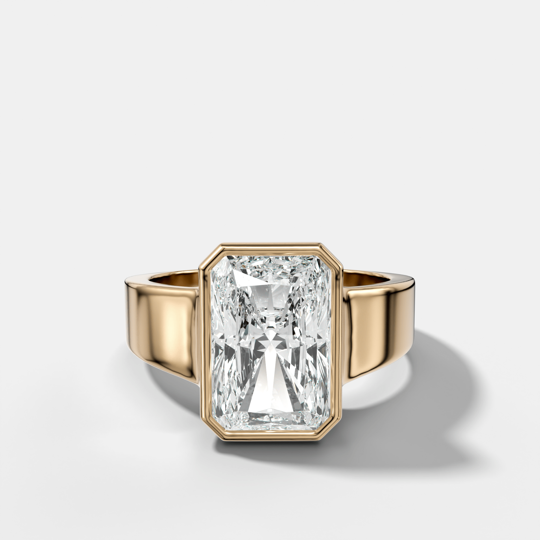 Finest Tapered Bezel Set Engagement Ring With Elongated Radiant Cut Diamond