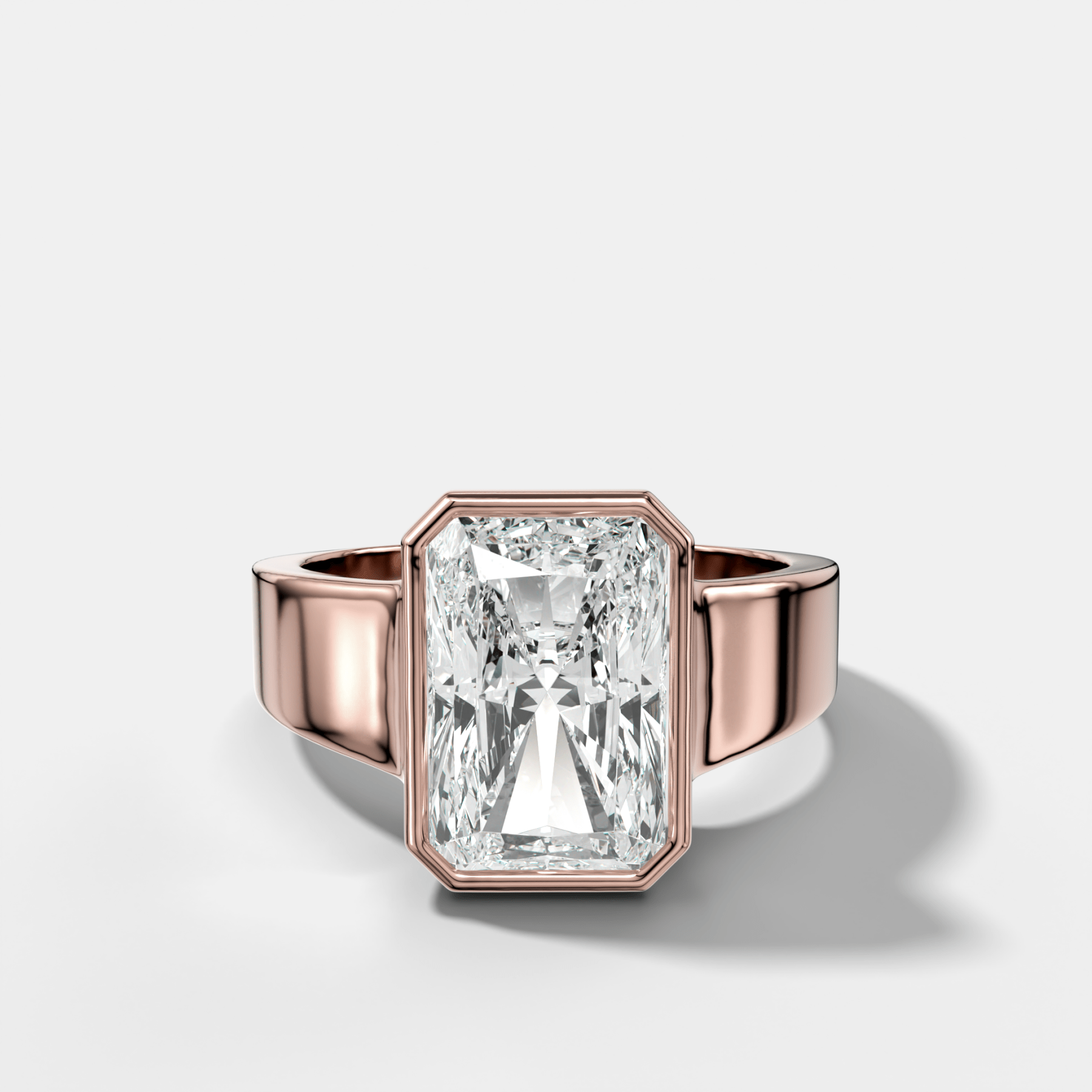Finest Tapered Bezel Set Engagement Ring With Elongated Radiant Cut Diamond