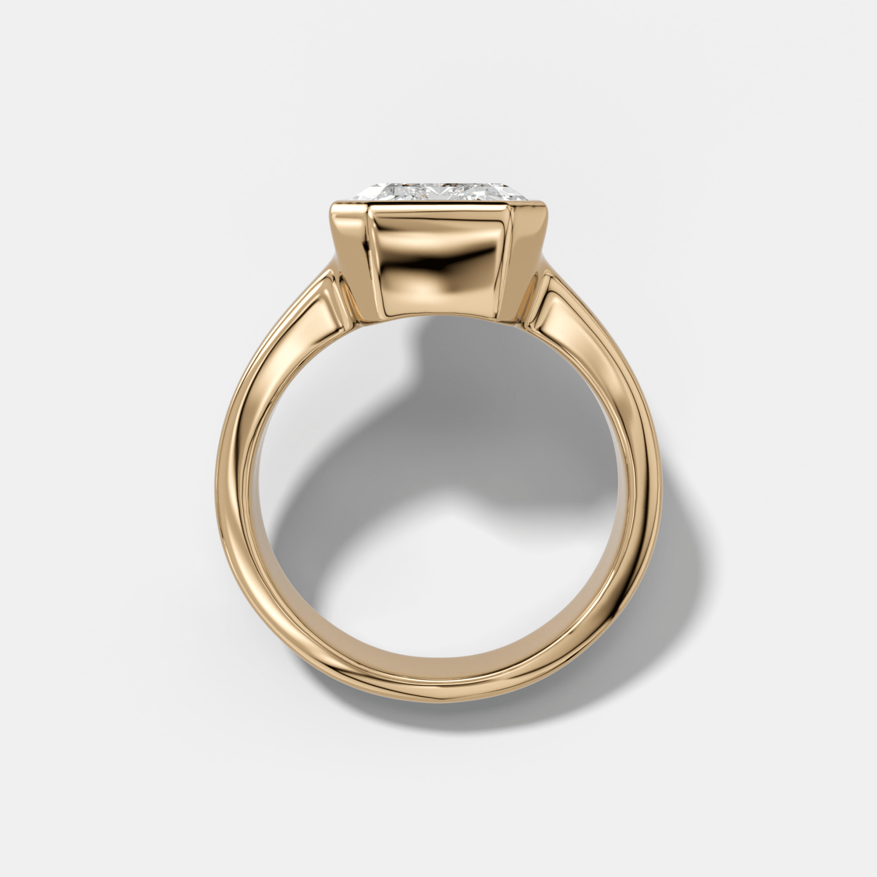 Finest Tapered Bezel Set Engagement Ring With Emerald Cut Diamond