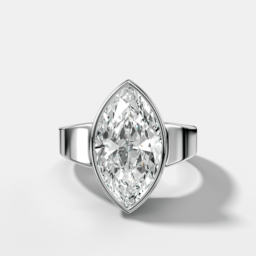 Finest Tapered Bezel Set Engagement Ring With Marquise Cut Diamond