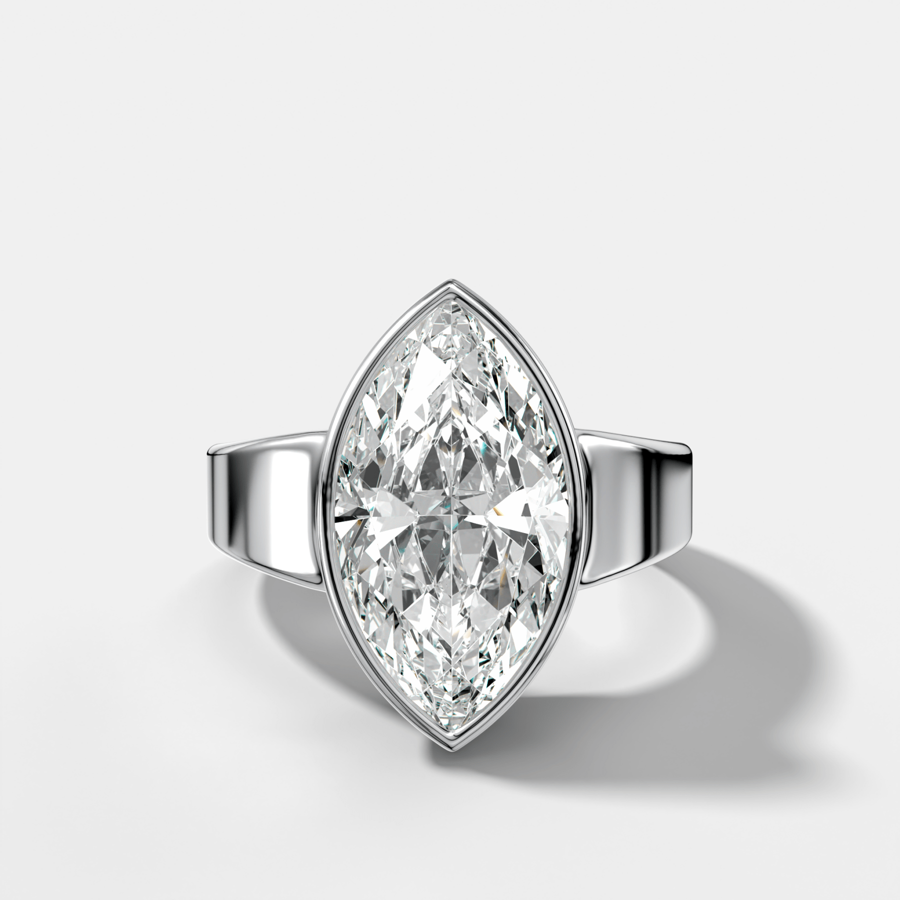 Finest Tapered Bezel Set Engagement Ring With Marquise Cut Diamond
