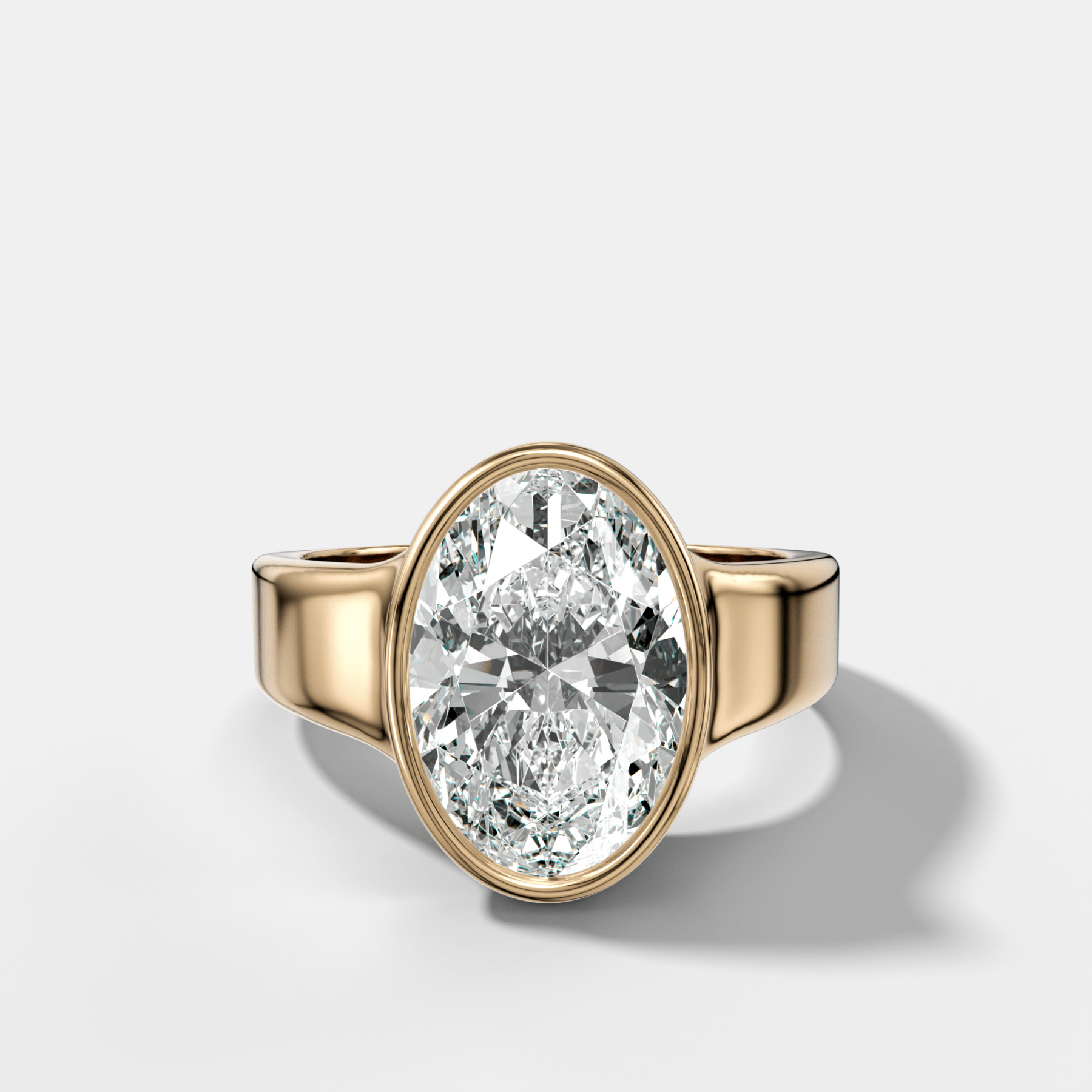 Finest Tapered Bezel Set Engagement Ring With Oval Cut Diamond