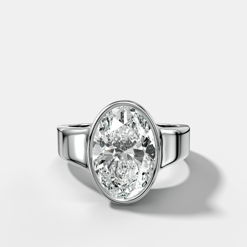 Finest Tapered Bezel Set Engagement Ring With Oval Cut Diamond