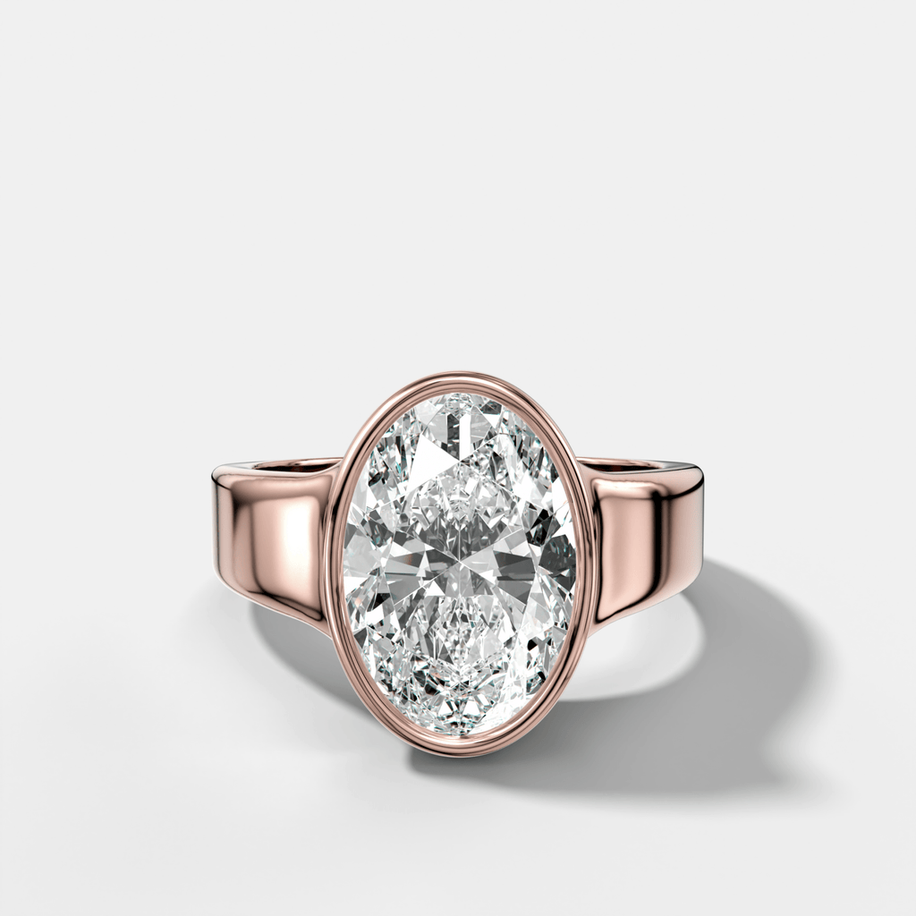 Finest Tapered Bezel Set Engagement Ring With Oval Cut Diamond