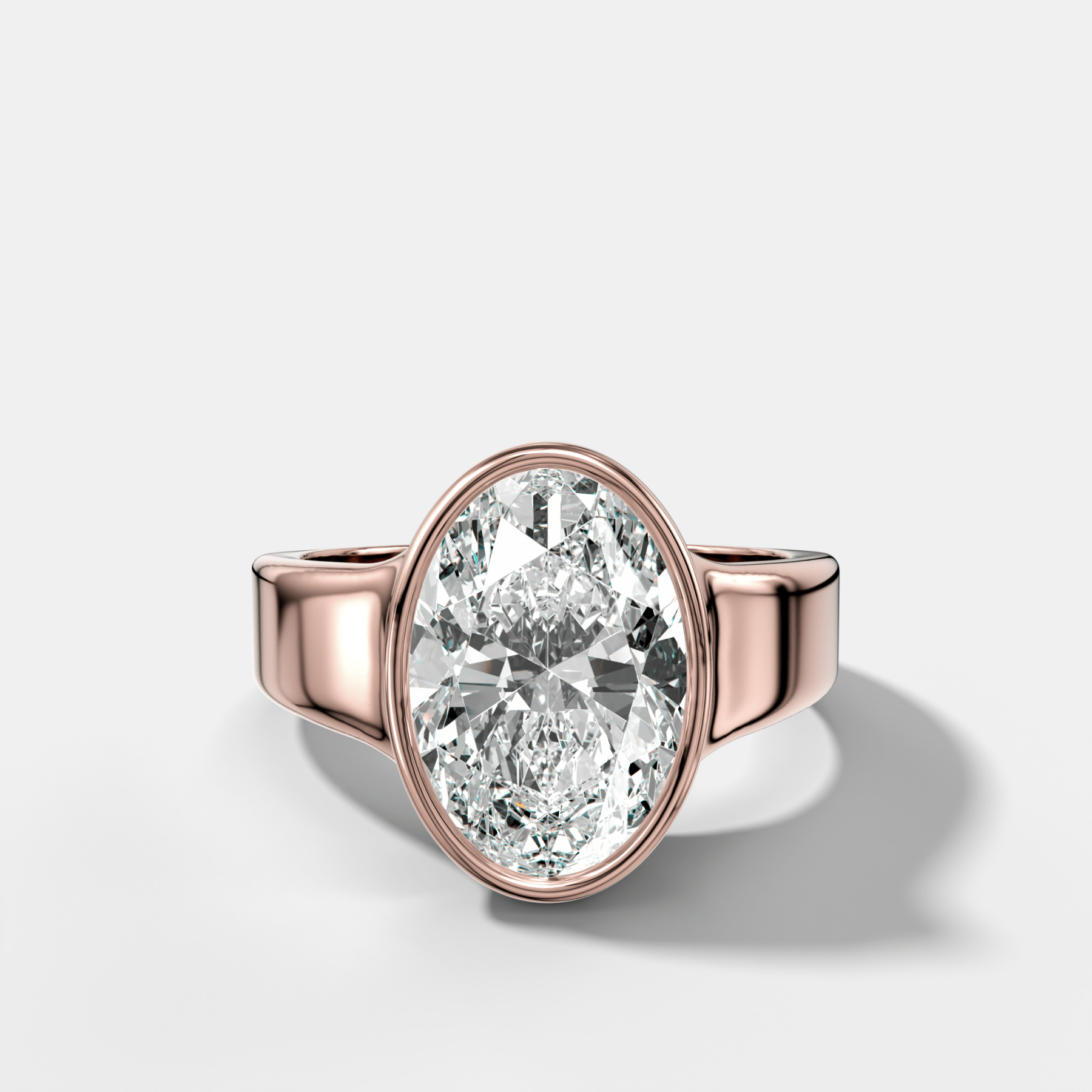 Finest Tapered Bezel Set Engagement Ring With Oval Cut Diamond