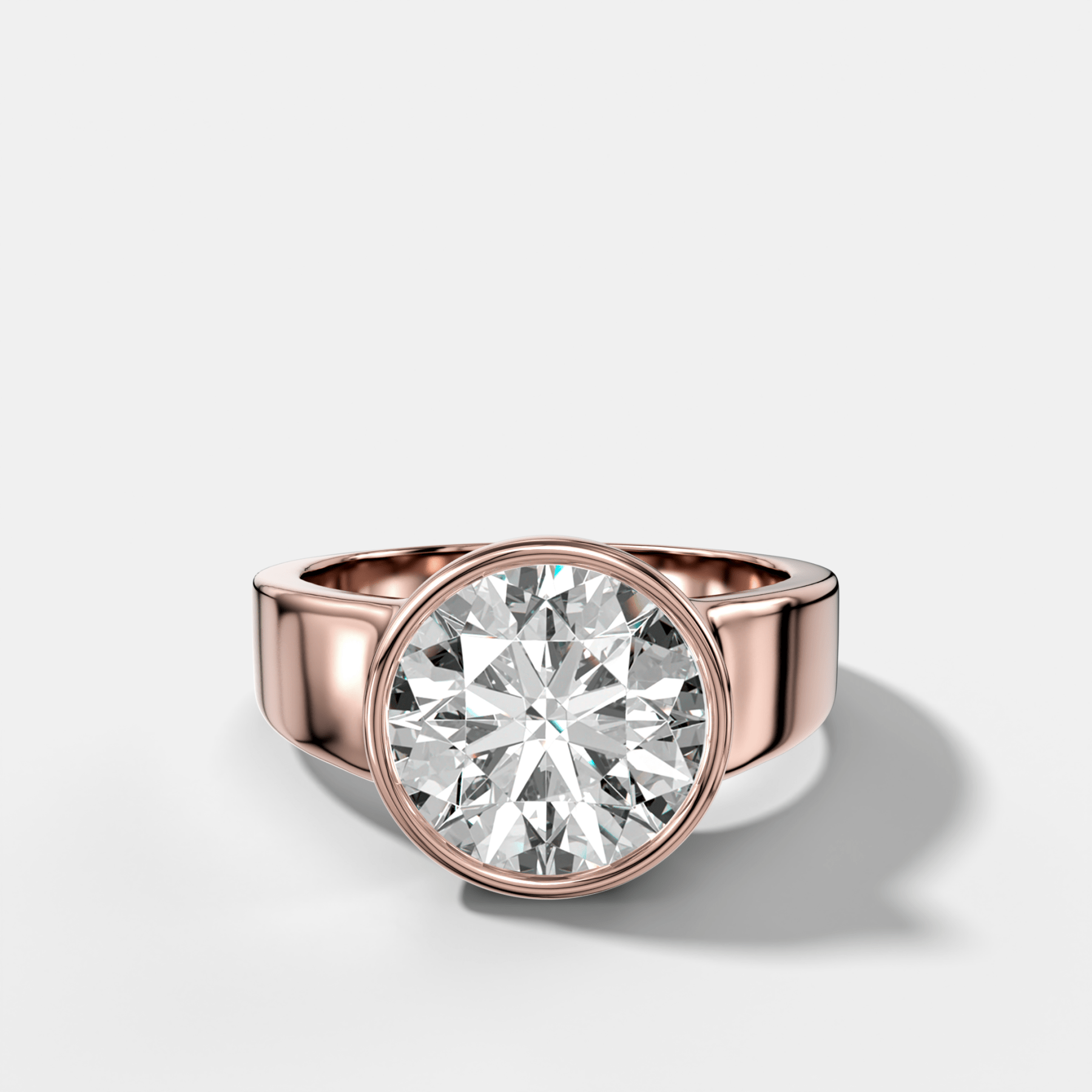 Finest Tapered Bezel Set Engagement Ring With Round Cut Diamond